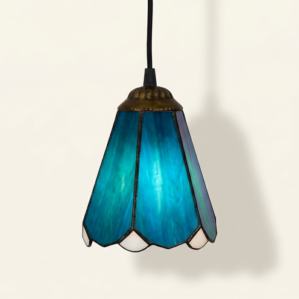 Azuletta, 6 Inch Tiffany-style stained glass pendant light, lit, on a plain ivory studio background