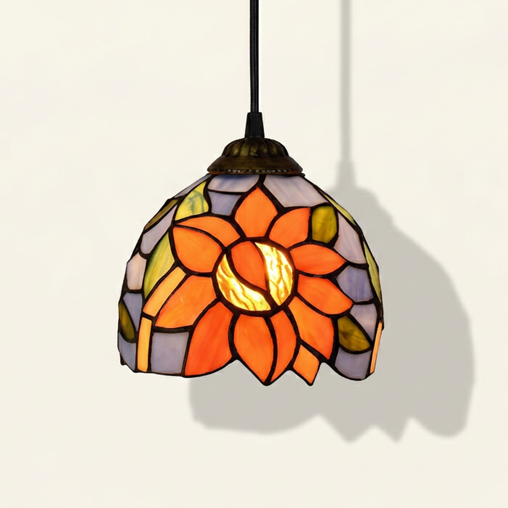 Soleia, 6 Inch Tiffany-style stained glass pendant light, lit, on a plain ivory studio background