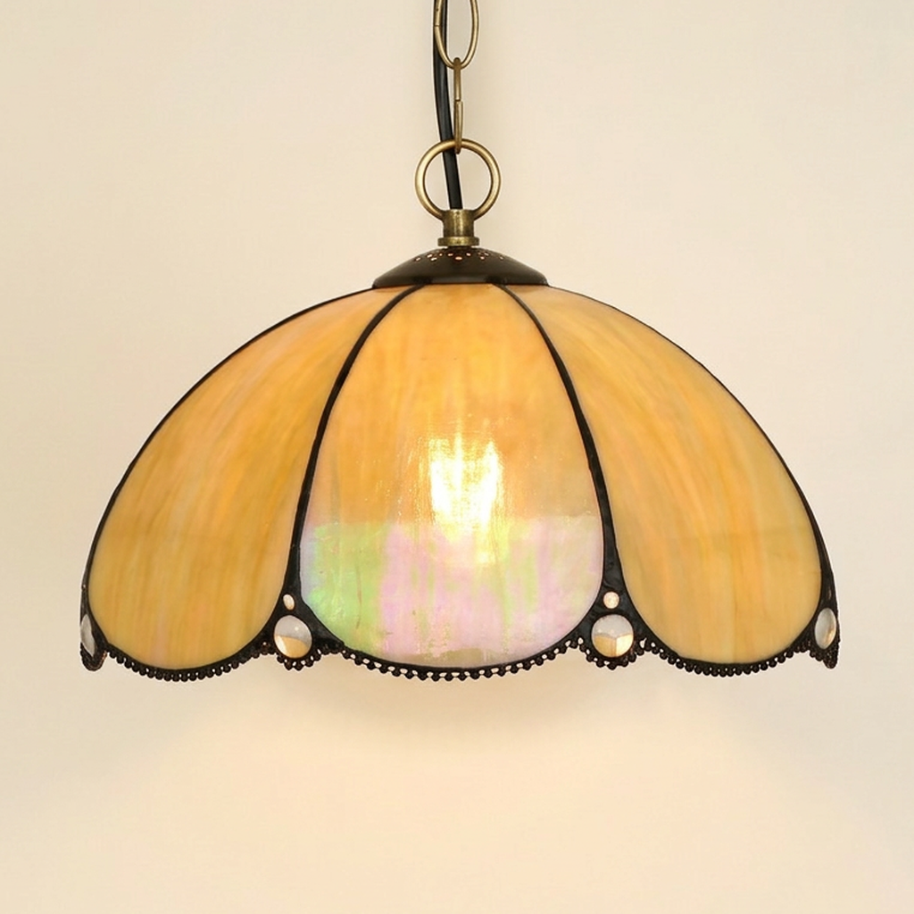 Toscana, 12 Inch Tiffany-style stained glass pendant light, lit, on a plain ivory studio background