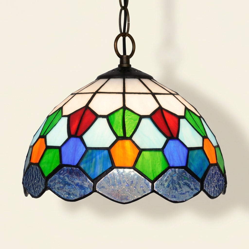 Diamante, 10 Inch Tiffany-style stained glass pendant light, lit, on a plain ivory studio background