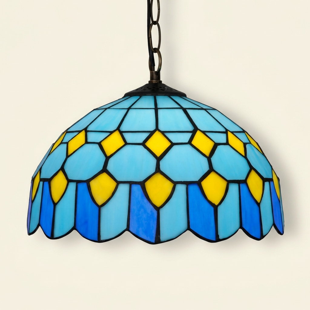 Cortina, 12 Inch Tiffany-style stained glass pendant light, lit, on a plain ivory studio background