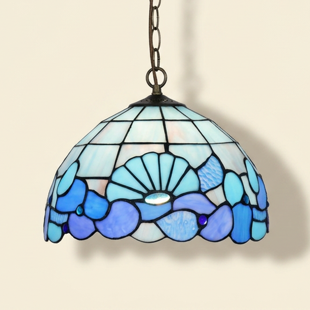 Marbeau, 12 Inch Tiffany-style stained glass pendant light, lit, on a plain ivory studio background