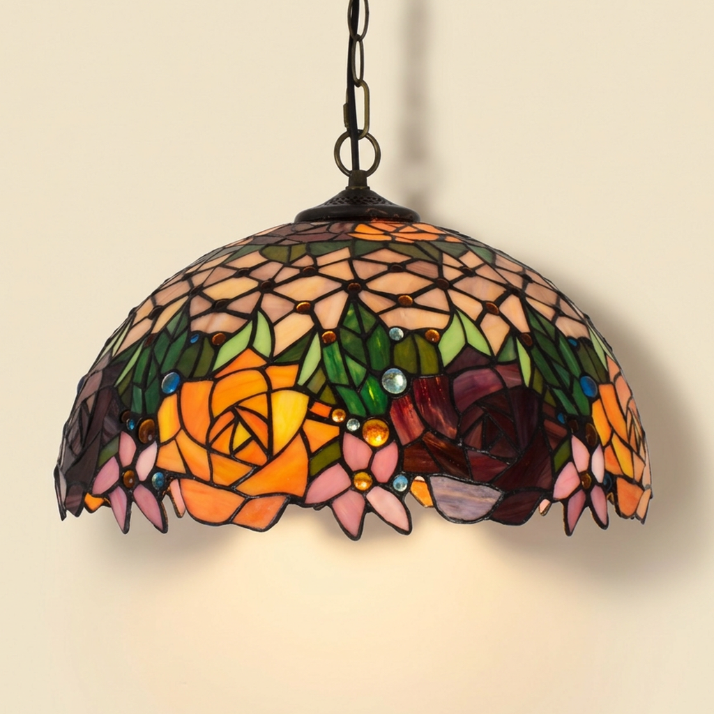 Fleuranne, 16 Inch Tiffany-style stained glass pendant light, lit, on a plain ivory studio background