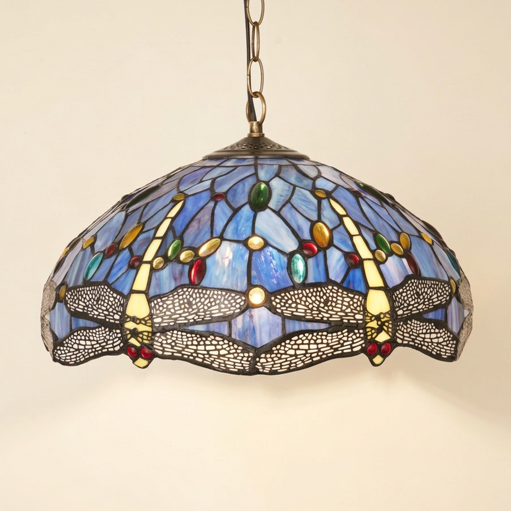 Zephyrine, 16 Inch Tiffany-style stained glass pendant light, lit, on a plain ivory studio background