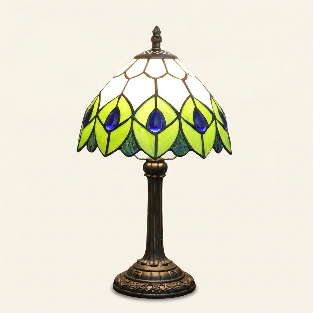 Almira 8 Inch Tiffany-style stained glass table lamp, lit, on a plain ivory studio background