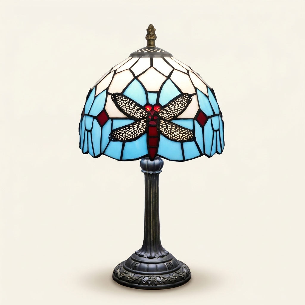Elmira 8 Inch Tiffany-style stained glass table lamp, lit, on a plain ivory studio background
