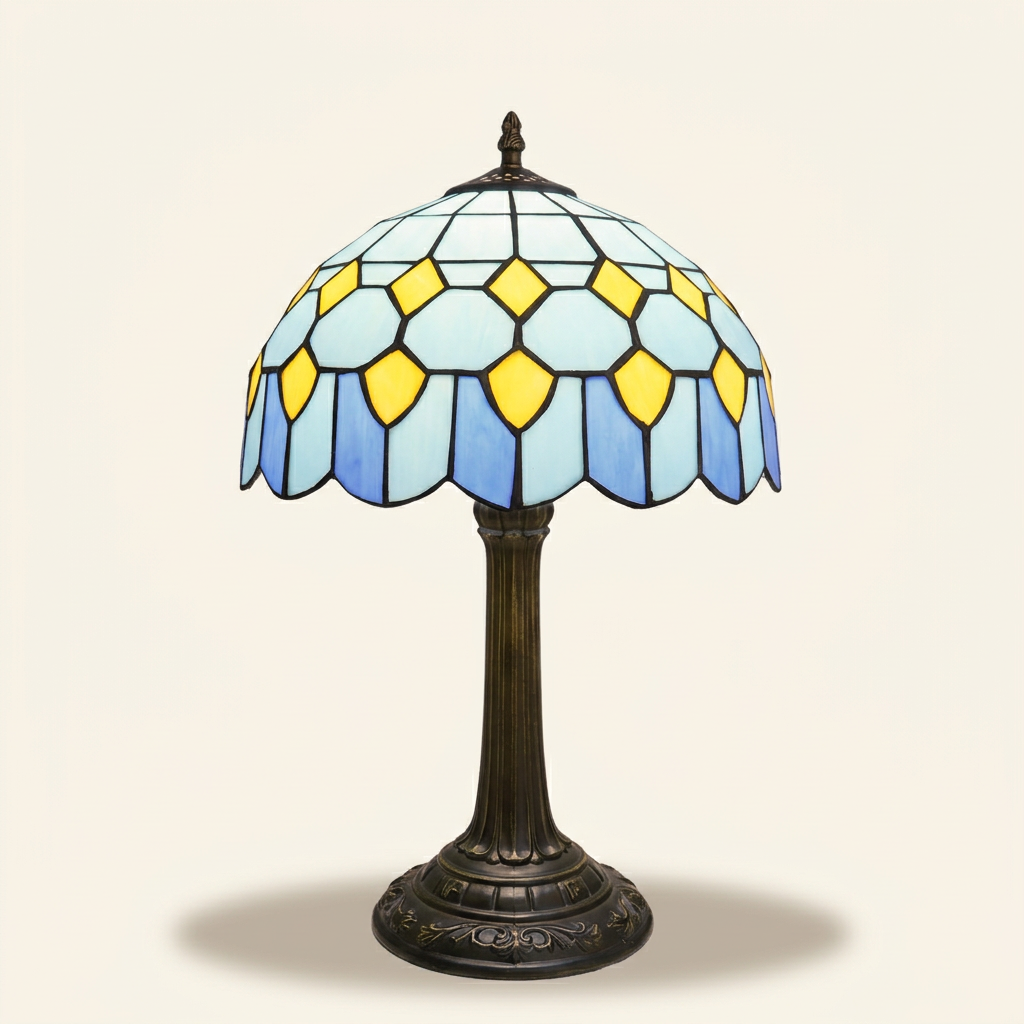 Chesney 12 Inch Tiffany-style stained glass table lamp, lit, on a plain ivory studio background