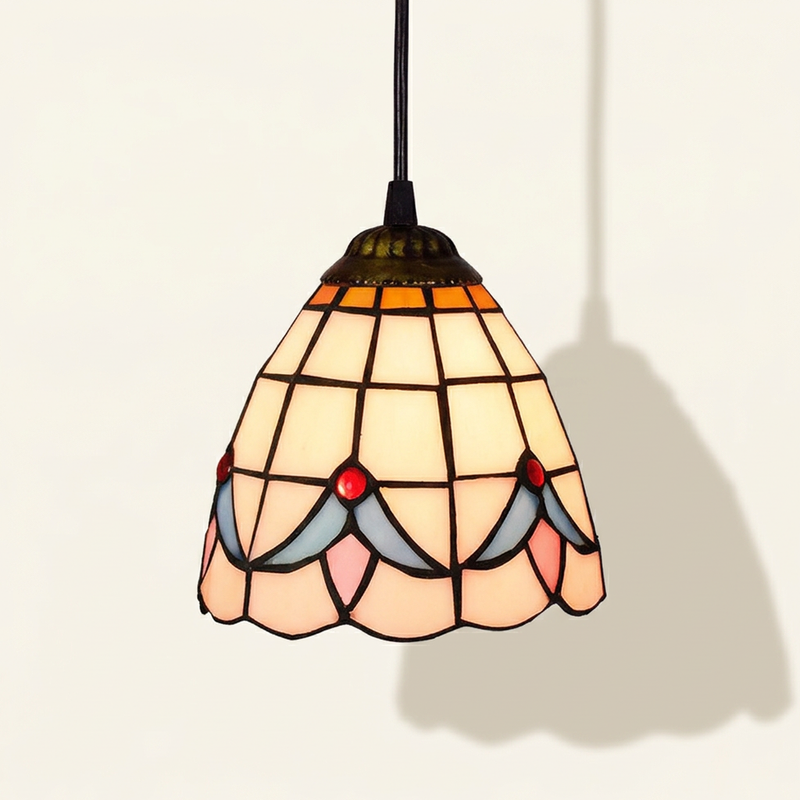 Magnolis, 6 Inch Tiffany-style stained glass pendant light, lit, on a plain ivory studio background