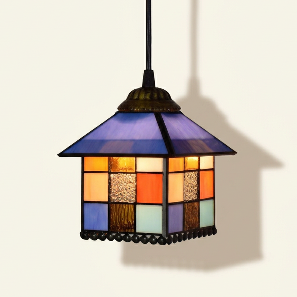 Chaumette, 8 Inch Tiffany-style stained glass pendant light, lit, on a plain ivory studio background
