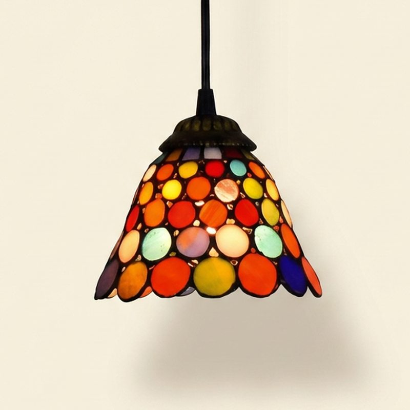 Girandole, 6-8 Inch - 6 Inches Tiffany-style stained glass pendant light, lit, on a plain ivory studio background