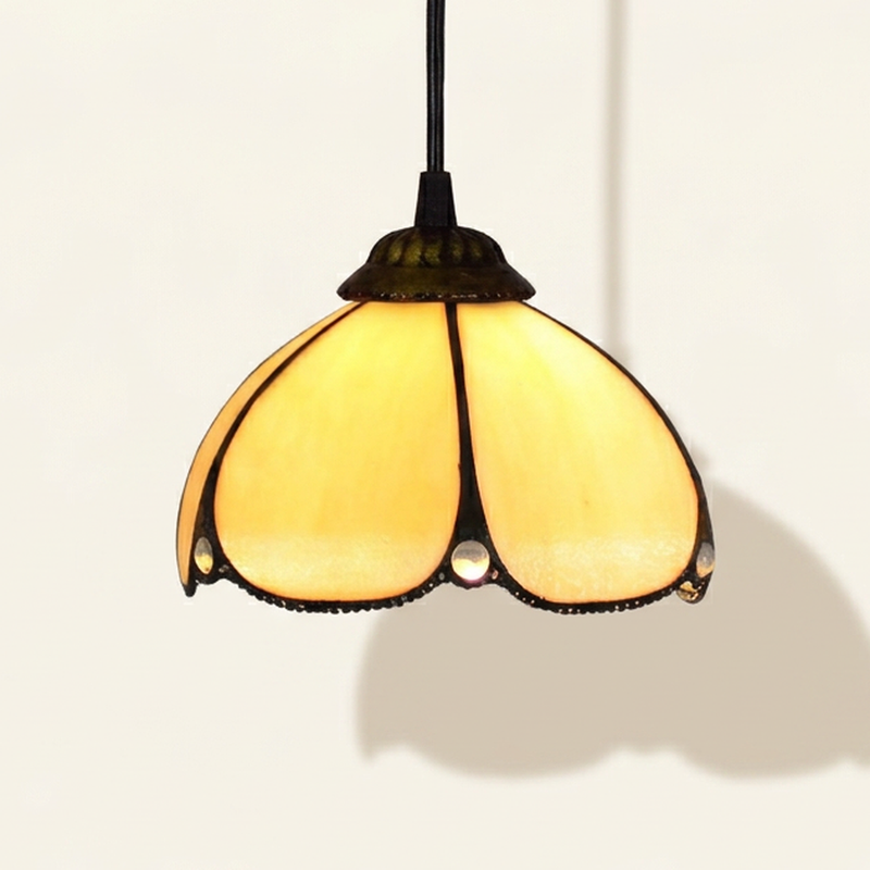 Toscana, 8 Inch Tiffany-style stained glass pendant light, lit, on a plain ivory studio background