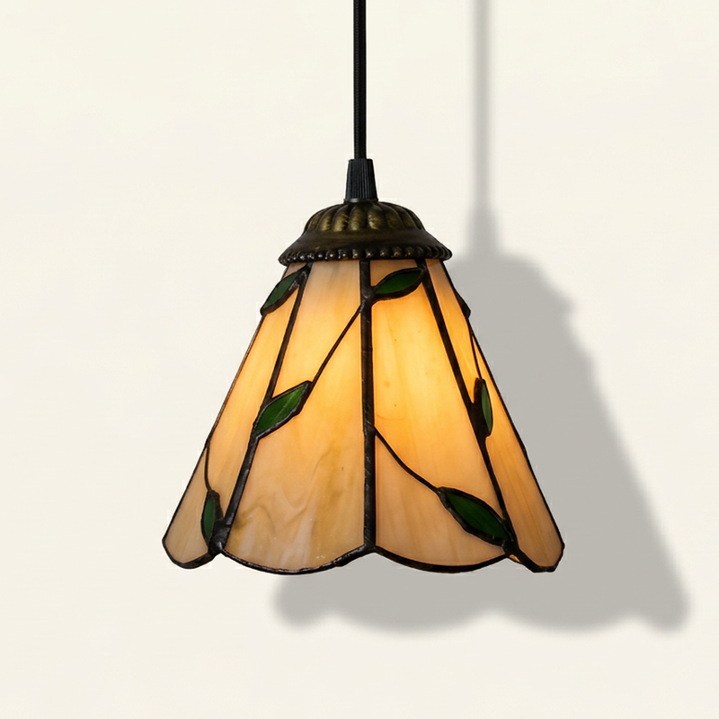 Ambrelle, 6 Inch Tiffany-style stained glass pendant light, lit, on a plain ivory studio background