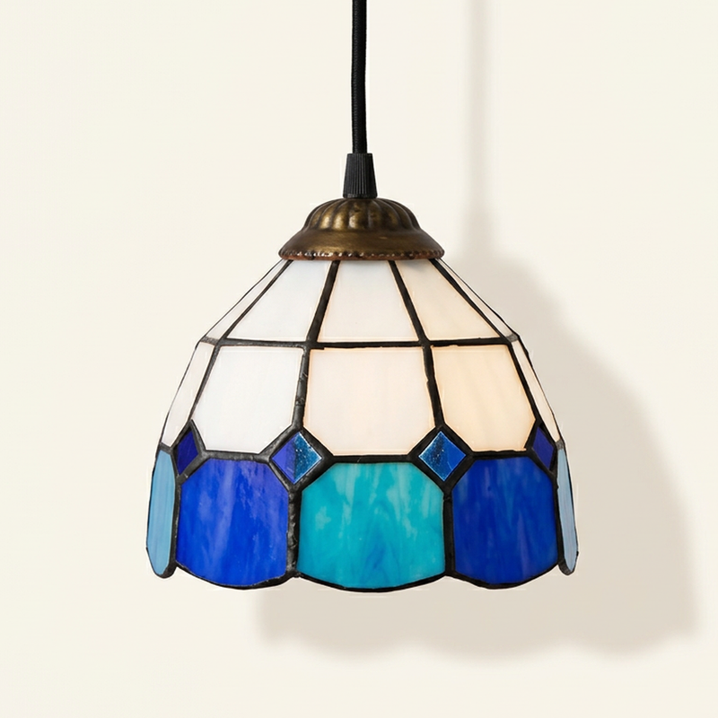 Ainsworth, 6-8 Inch - 6 Inches / Blue White Tiffany-style stained glass pendant light, lit, on a plain ivory studio background