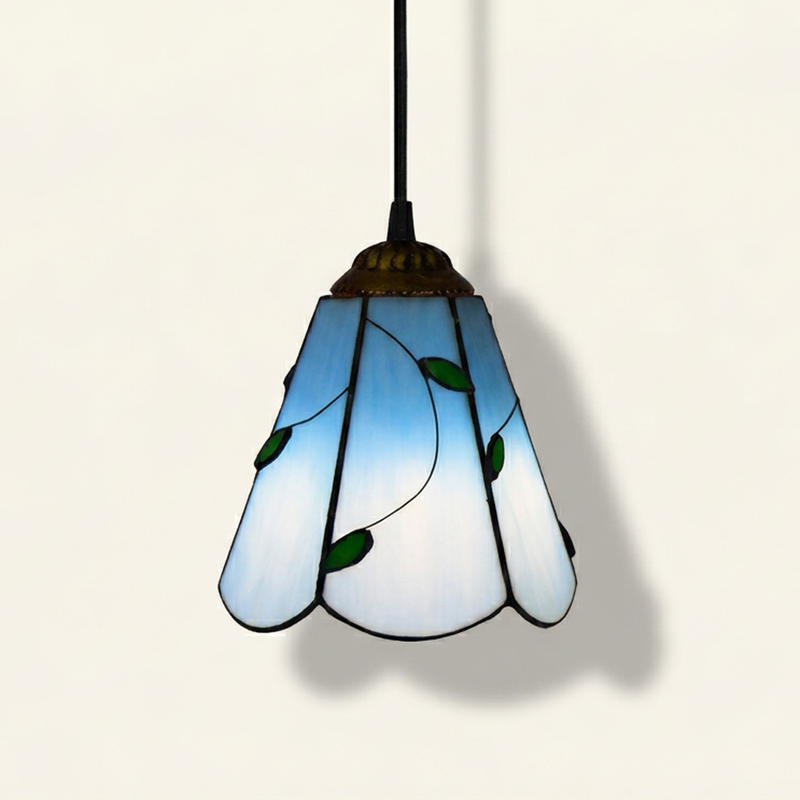 Foliara, 6 Inch Tiffany-style stained glass pendant light, lit, on a plain ivory studio background
