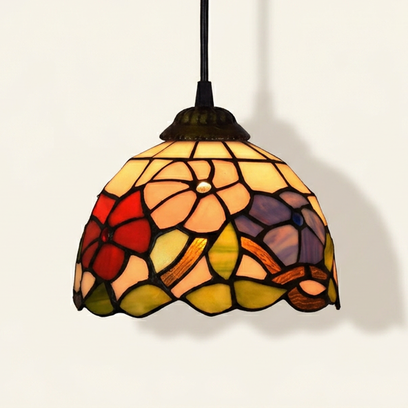 Aurenne, 8 Inch Tiffany-style stained glass pendant light, lit, on a plain ivory studio background