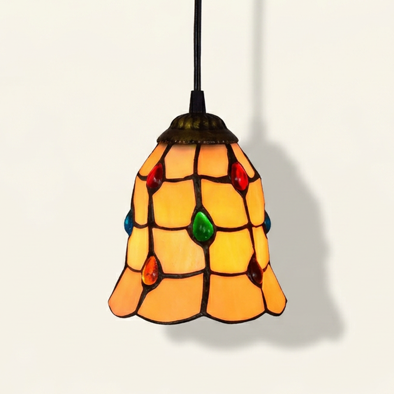Bijou, 6 Inch Tiffany-style stained glass pendant light, lit, on a plain ivory studio background