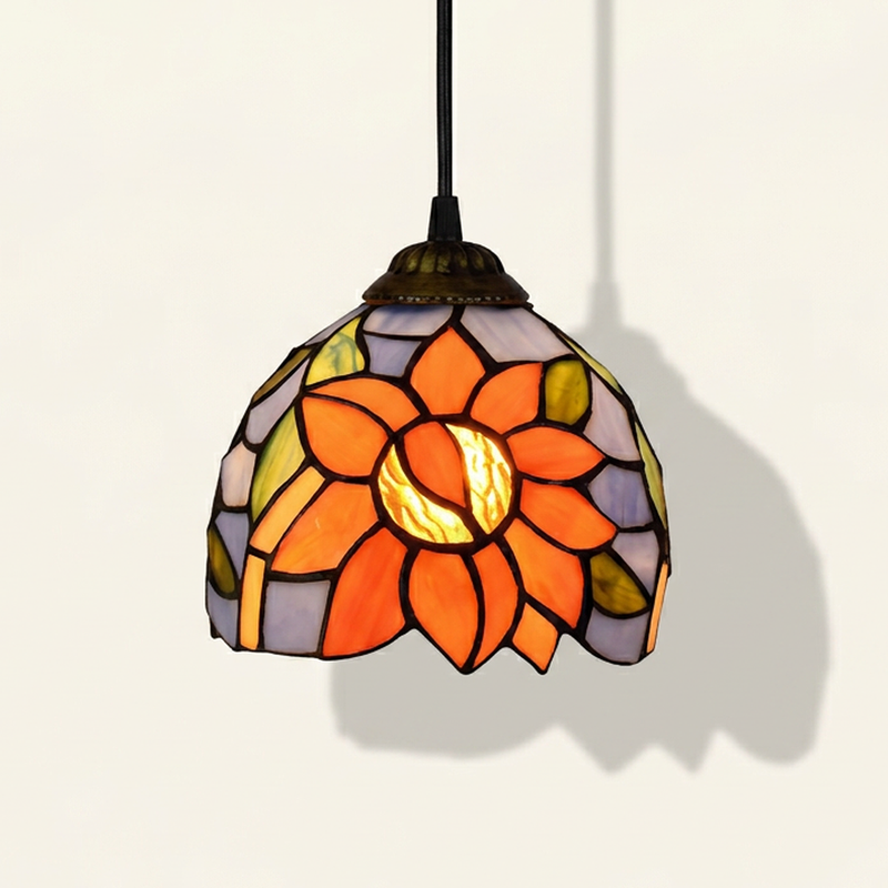 Soleia, 6 Inch Tiffany-style stained glass pendant light, lit, on a plain ivory studio background
