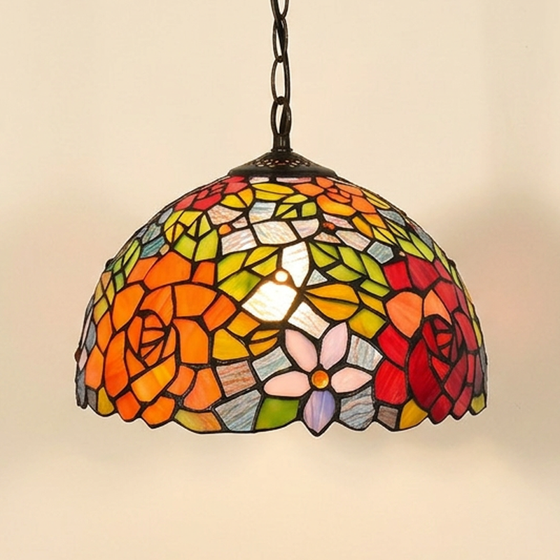 Florelle, 12 Inch Tiffany-style stained glass pendant light, lit, on a plain ivory studio background
