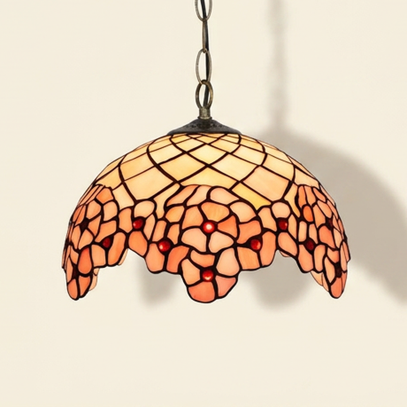 Hanabelle, 12 Inch Tiffany-style stained glass pendant light, lit, on a plain ivory studio background