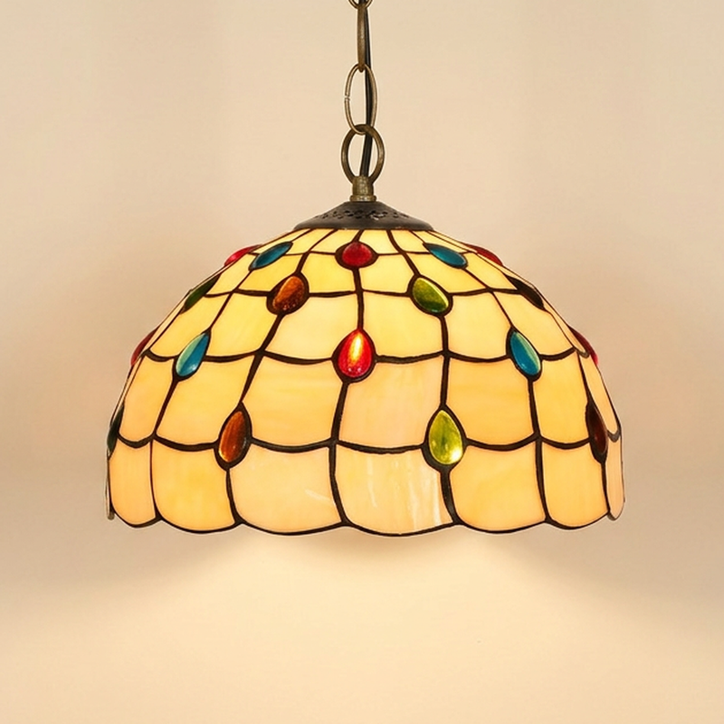 Bijou, 12 Inch Tiffany-style stained glass pendant light, lit, on a plain ivory studio background