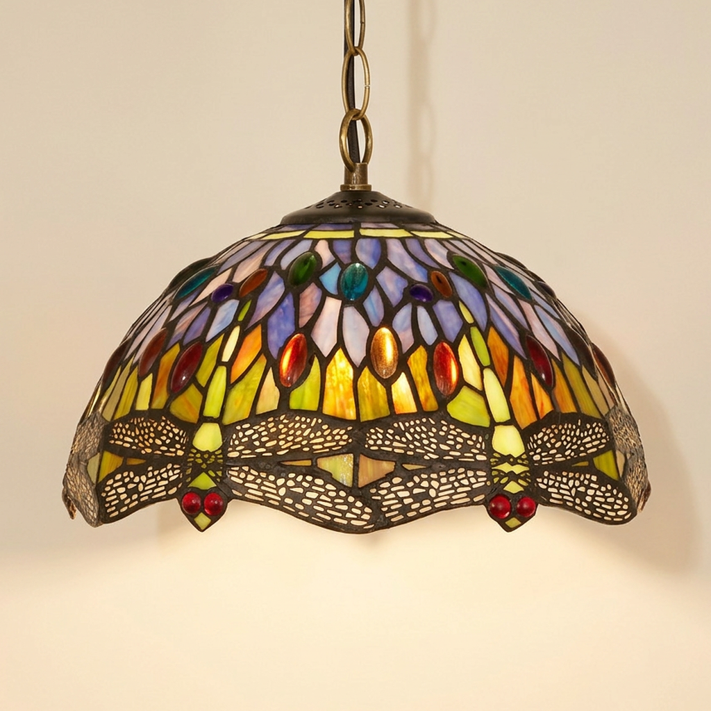 Lumiara, 12 Inch Tiffany-style stained glass pendant light, lit, on a plain ivory studio background