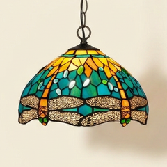 Odessa, 12 Inch - Green Yellow Tiffany-style stained glass pendant light, lit, on a plain ivory studio background