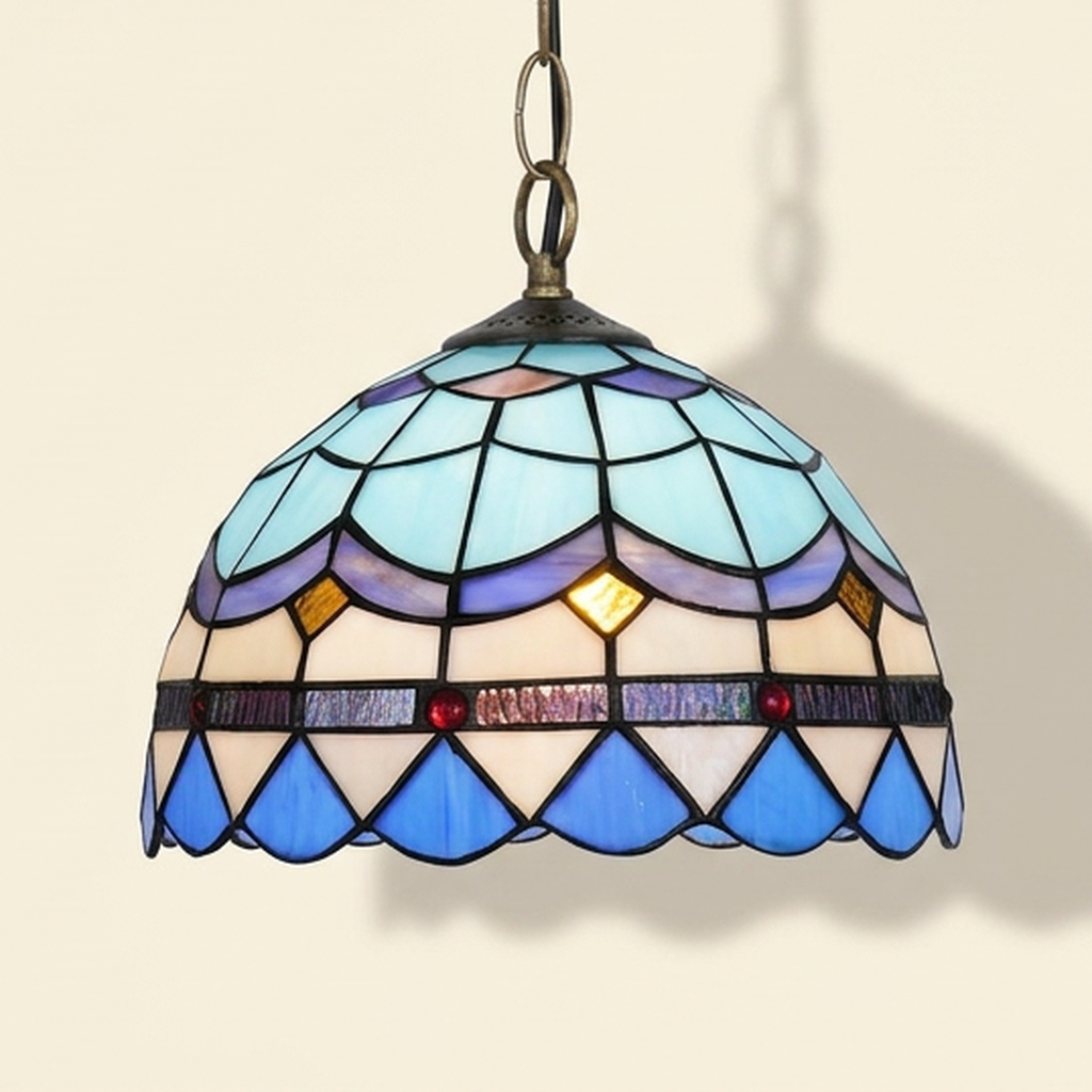 Plumaris, 12 Inch Tiffany-style stained glass pendant light, lit, on a plain ivory studio background