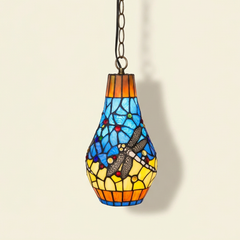 Lucienne, 7 Inch - Yellow Tiffany-style stained glass pendant light, lit, on a plain ivory studio background