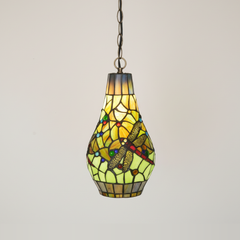 Lucienne, 7 Inch - Green Tiffany-style stained glass pendant light, lit, on a plain ivory studio background