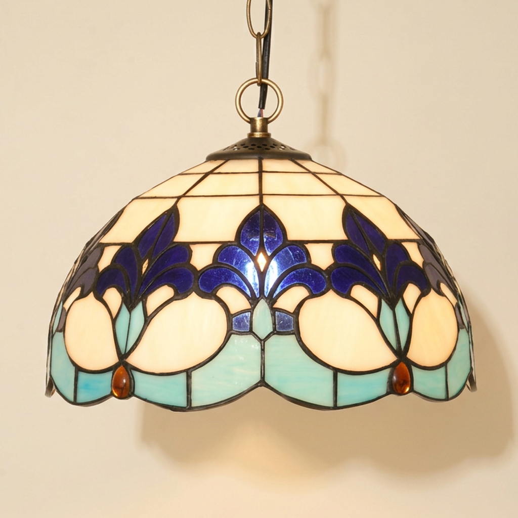 Fleurine, 12 Inch Tiffany-style stained glass pendant light, lit, on a plain ivory studio background
