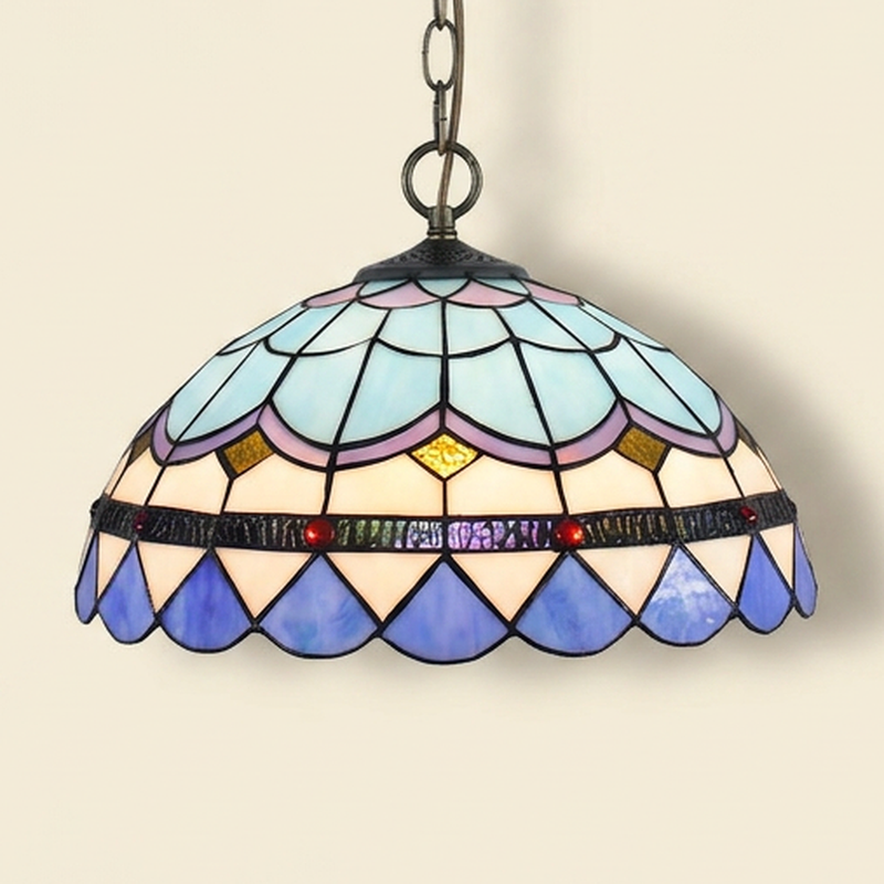 Plumaris, 16 Inch Tiffany-style stained glass pendant light, lit, on a plain ivory studio background