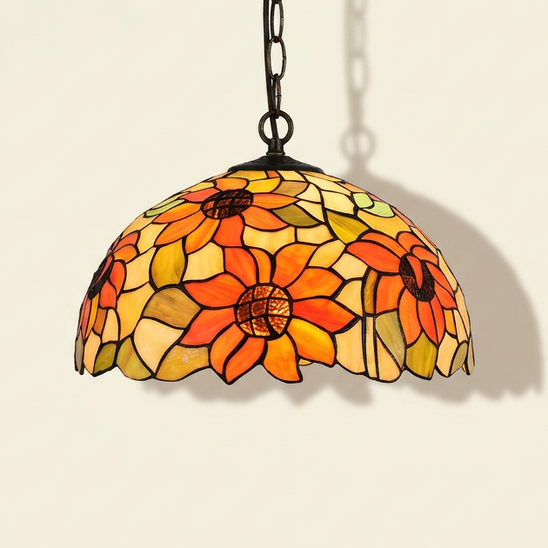 Heliette, 16 Inch Tiffany-style stained glass pendant light, lit, on a plain ivory studio background