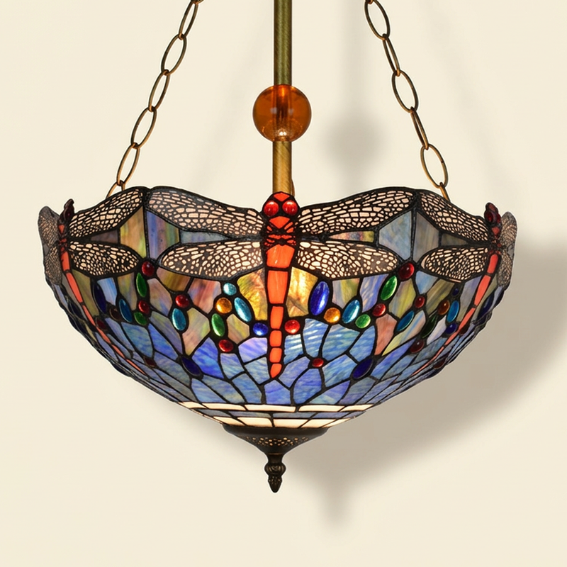 Cinnara, 16 Inch Tiffany-style stained glass pendant light, lit, on a plain ivory studio background