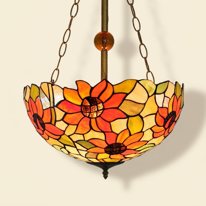 Heliose, 16 Inch Tiffany-style stained glass pendant light, lit, on a plain ivory studio background