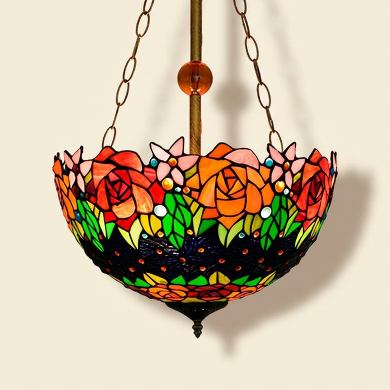 Noirelle, 16 Inch Tiffany-style stained glass pendant light, lit, on a plain ivory studio background