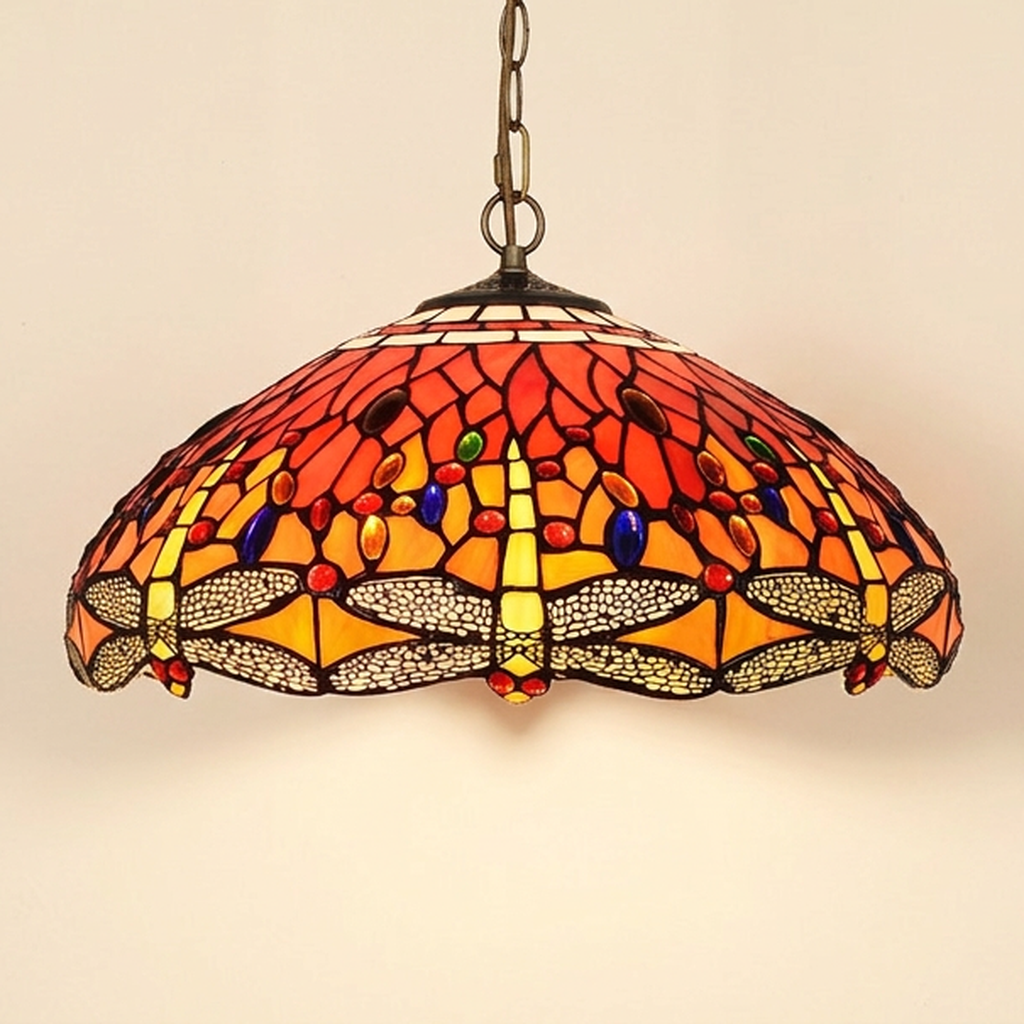 Cinnabelle, 18 Inch Tiffany-style stained glass pendant light, lit, on a plain ivory studio background