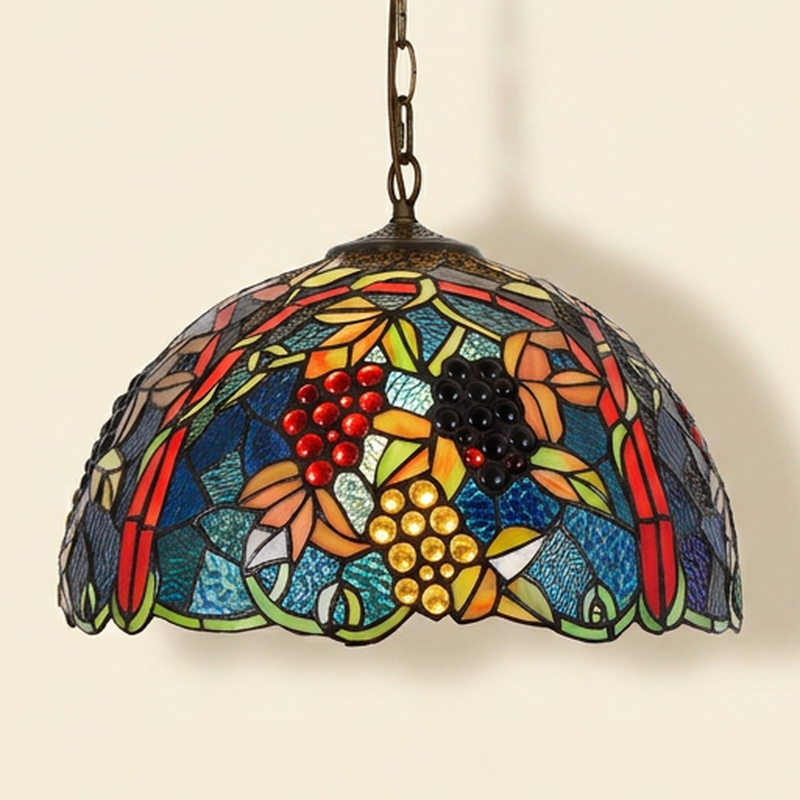 Vendelle, 17 Inch Tiffany-style stained glass pendant light, lit, on a plain ivory studio background