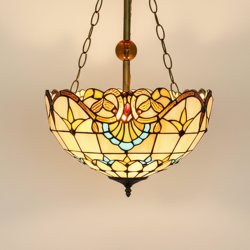 Ornella, 16 Inch Tiffany-style stained glass pendant light, lit, on a plain ivory studio background