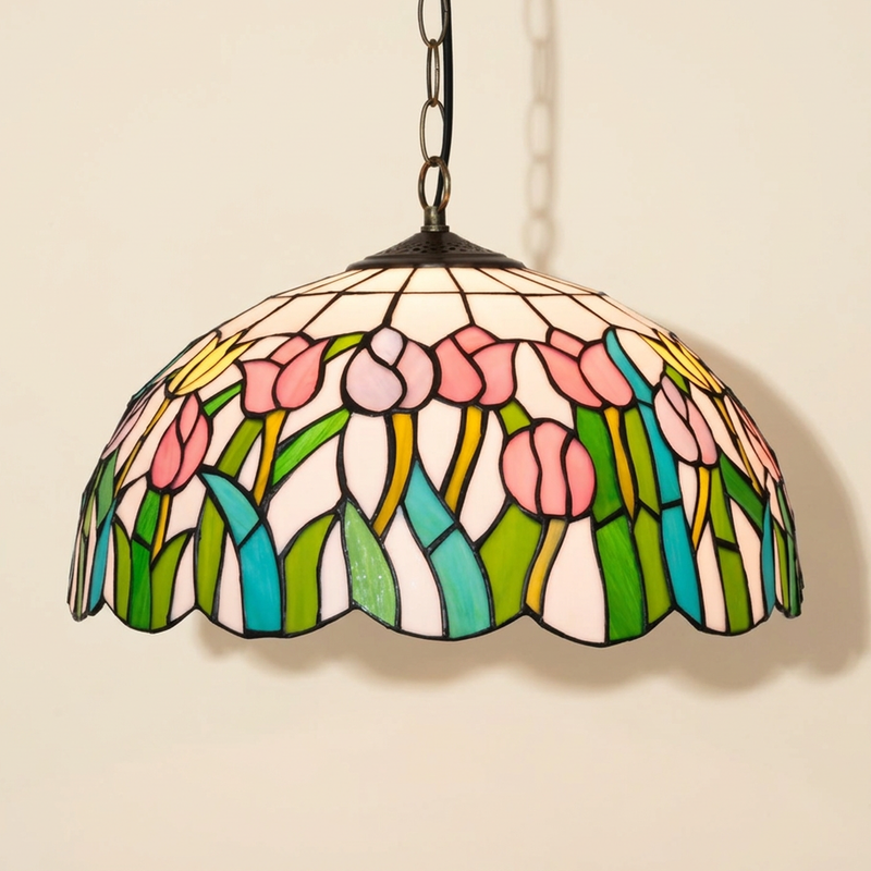 Tullia, 16 Inch Tiffany-style stained glass pendant light, lit, on a plain ivory studio background
