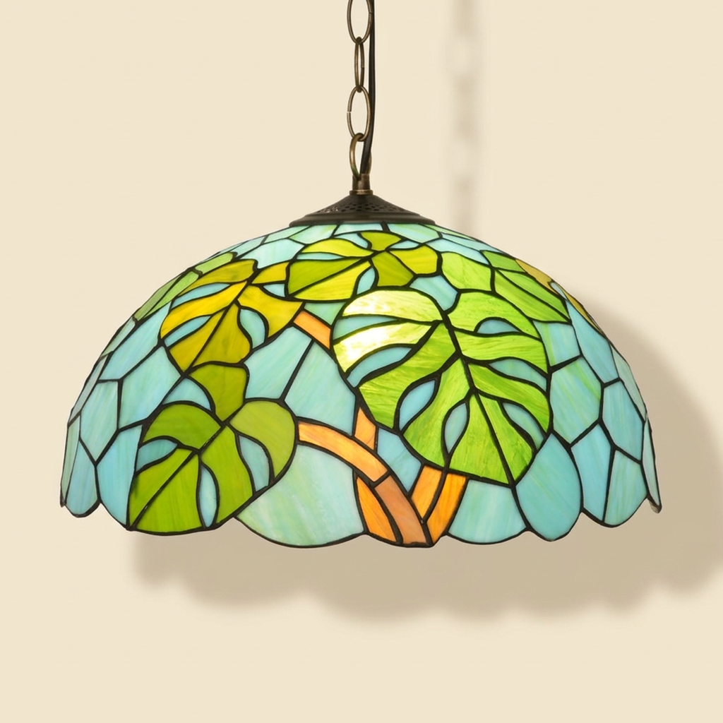 Takeda, 16 Inch Tiffany-style stained glass pendant light, lit, on a plain ivory studio background