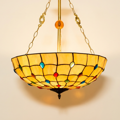 Bijou, 20-24 Inch - 20 Inches Tiffany-style stained glass pendant light, lit, on a plain ivory studio background