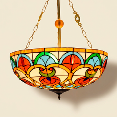 Caridelle, 20-24 Inch - 24 Inches Tiffany-style stained glass pendant light, lit, on a plain ivory studio background