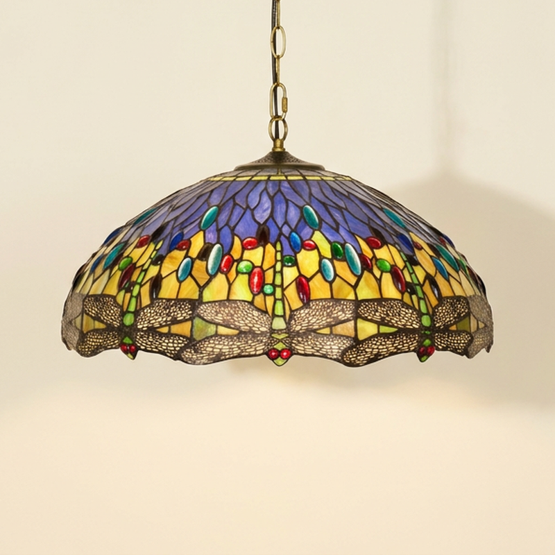 Lumienne, 20 Inch Tiffany-style stained glass pendant light, lit, on a plain ivory studio background