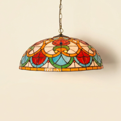 Caridonne, 20-24 Inch - Deep Mouth Tiffany-style stained glass pendant light, lit, on a plain ivory studio background