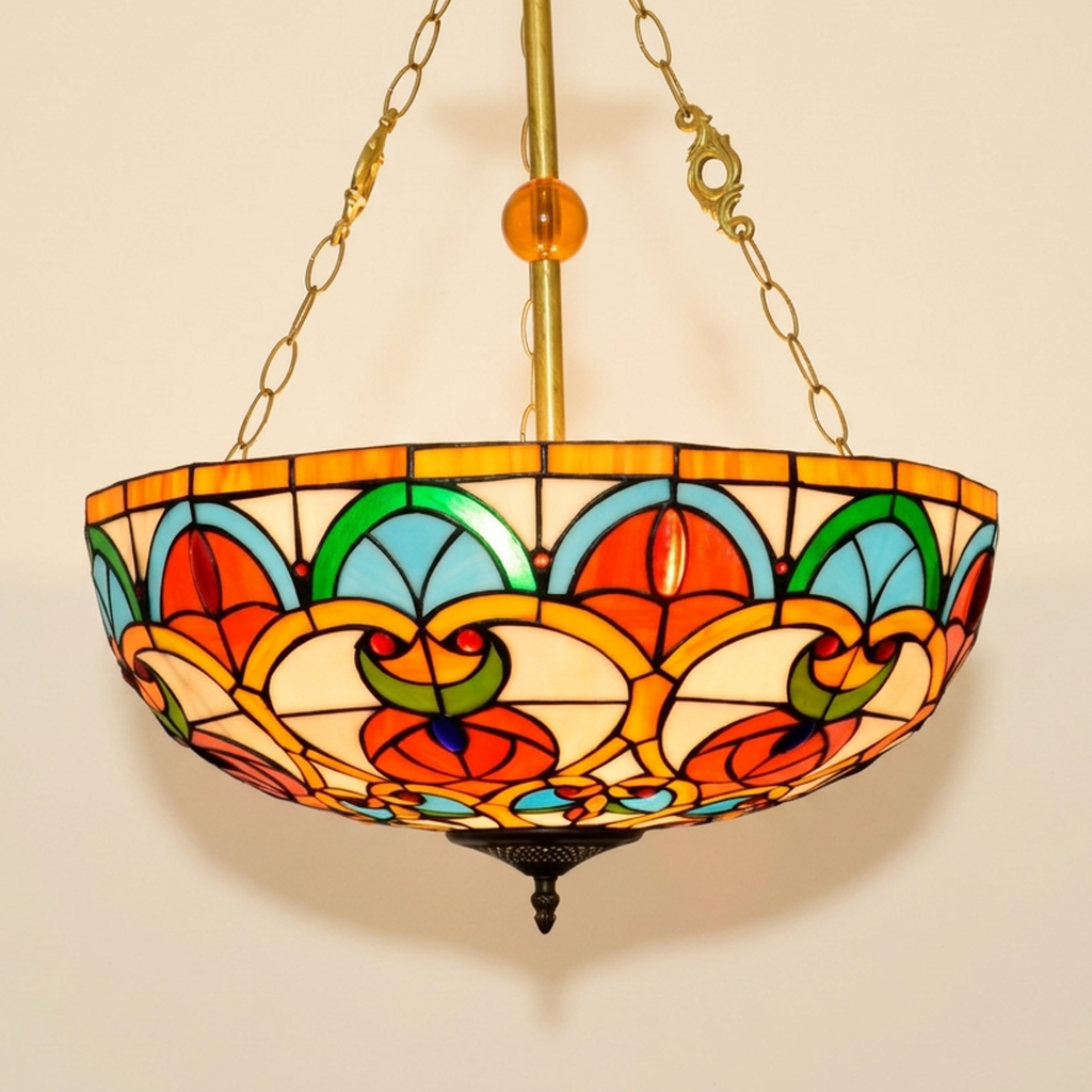 Caridelle, 20-24 Inch - 20 Inches Tiffany-style stained glass pendant light, lit, on a plain ivory studio background