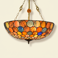 Girandole, 20-24 Inch - 24 Inches Tiffany-style stained glass pendant light, lit, on a plain ivory studio background