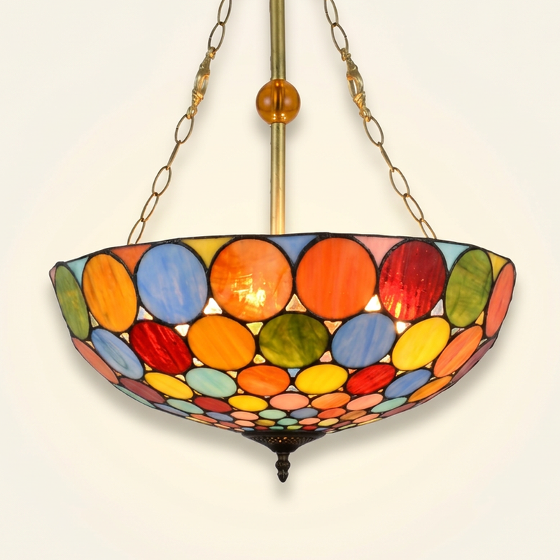Vinacer, 20 Inch Tiffany-style stained glass pendant light, lit, on a plain ivory studio background