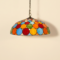 Girandelle, 20 Inch - Deep Mouth Tiffany-style stained glass pendant light, lit, on a plain ivory studio background