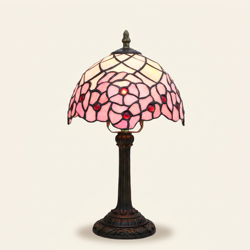 Sakurelle 8 Inch Tiffany-style stained glass table lamp, lit, on a plain ivory studio background