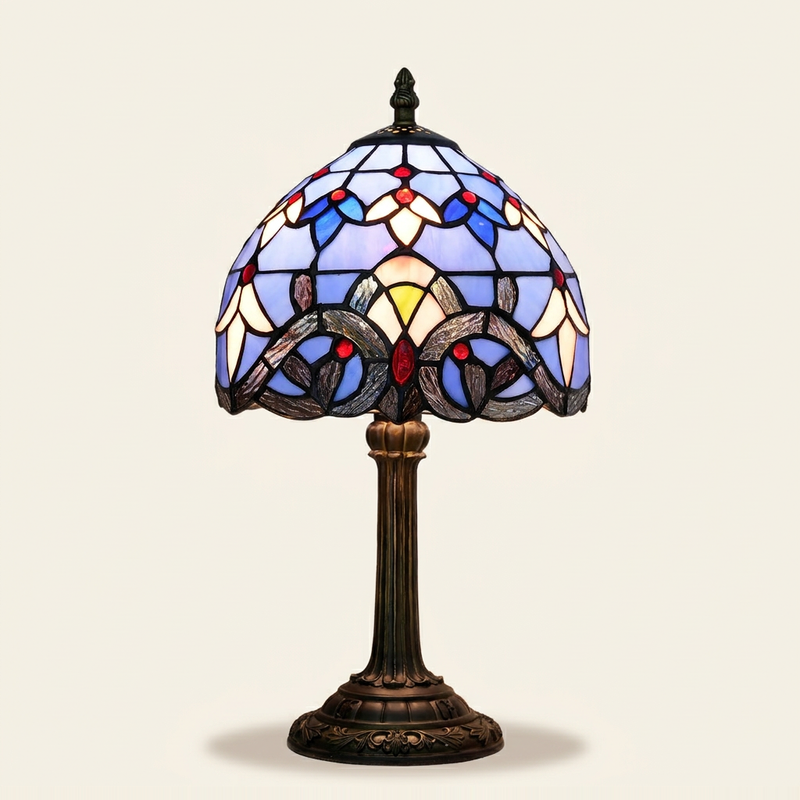 Bellamont 8 Inch Tiffany-style stained glass table lamp, Straight Pole base, lit, on a plain ivory studio background